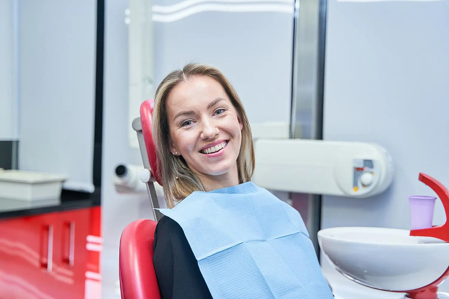 Woman smile represents choosing the right orthodontic treatment from adult orthodontics at NK Orthodontics in Suwanee or Tucker, GA