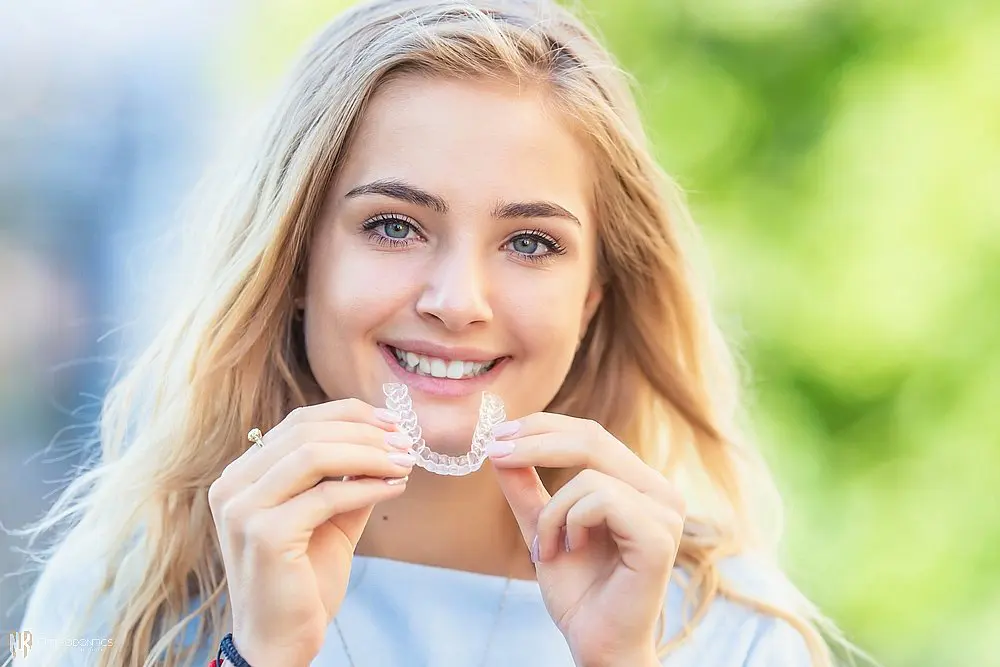 invisalign clear aligners orthodontics concept young attractive woman - How Does Invisalign Work in Suwanee and Tucker, GA 